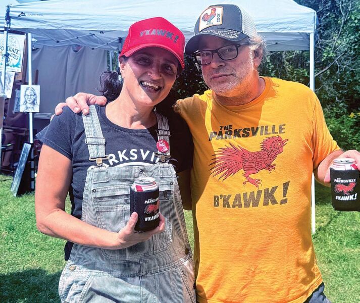 POULTRY PALS Festival cofounders Adrian and Todd Perlmutter pause to pose for the Ink’s reporter while supervising the B’kawk doings.